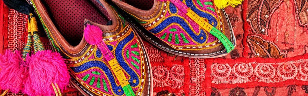 colorful slippers on rug India Carol Ketelson Delectable Destinations Culinary Tours
