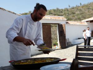 chef David Palacios servin Paella Carol Ketelson Delectable Destinations Culinary Tours