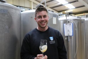 Man drinking on brewery tour