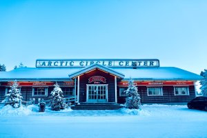 Restaurant with two Christmas trees in a snowy winter scene