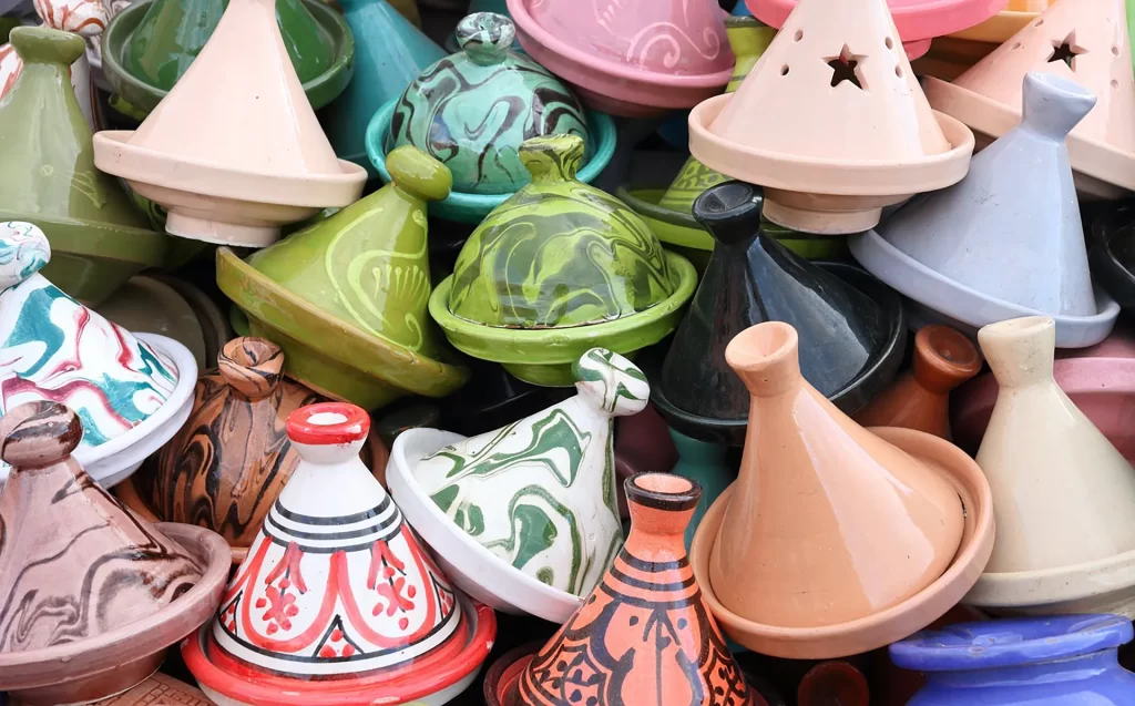 pile of Moroccan tagines of varying colors and patterns