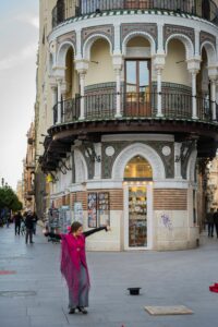 Flamenco dancer on a traditional street corner in Seville, Spain