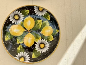 Painted plate with lemons on it in the Amalfi Coast