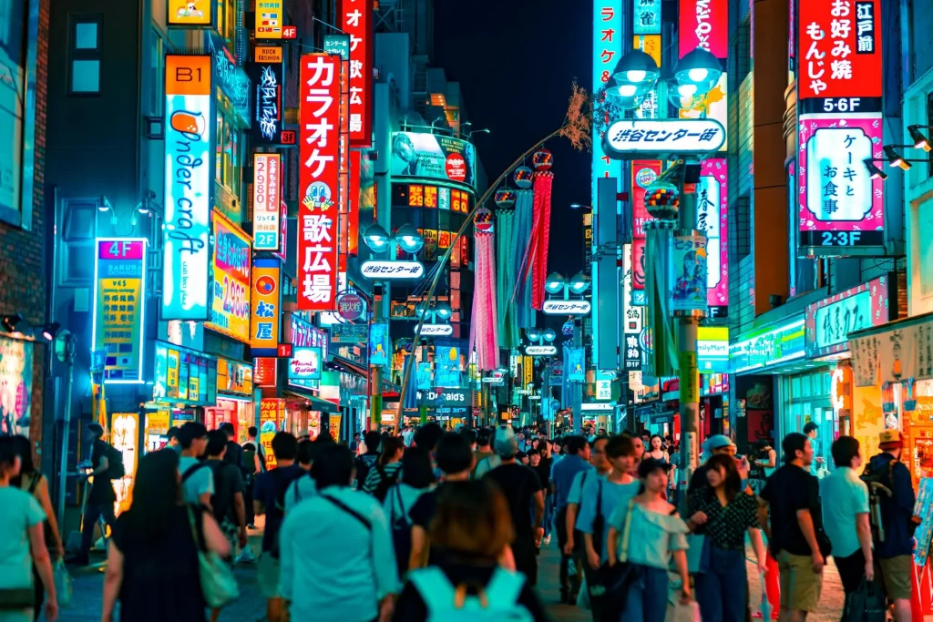 Busy street with pedestrians and bright lights in Japan