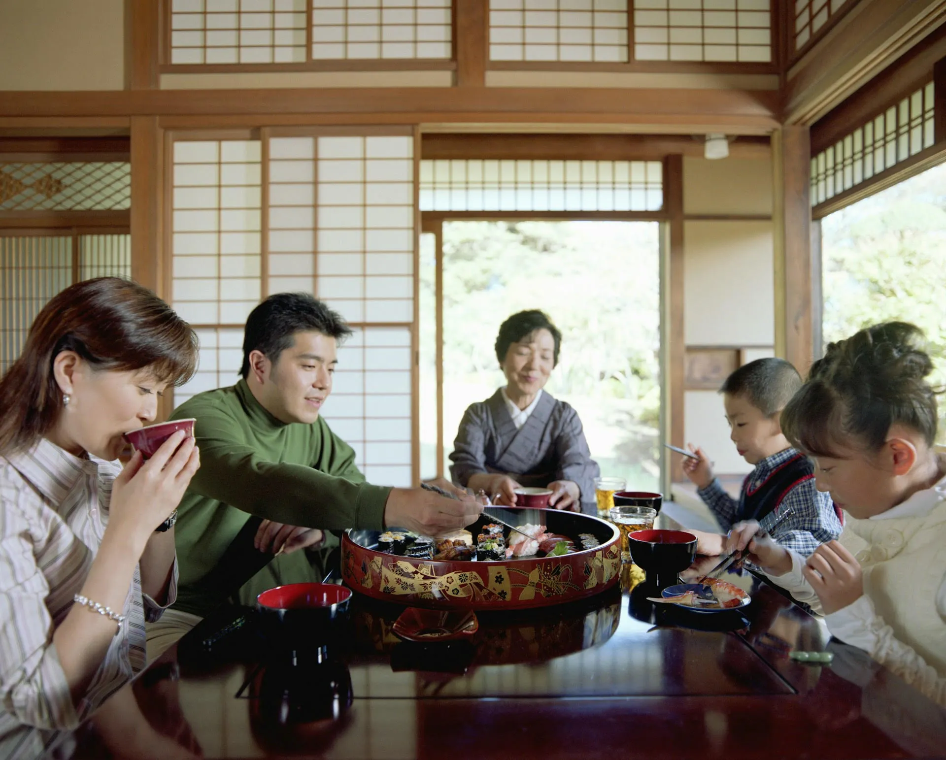 Family sharing a Japanese meal