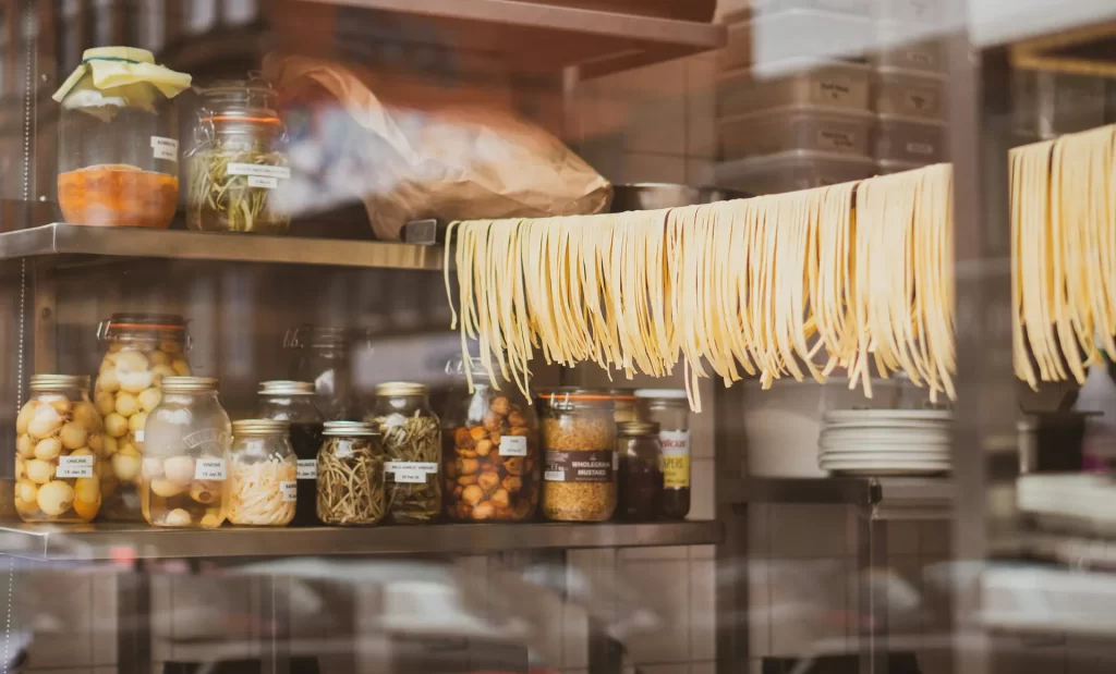 Handmade pasta hanging in a storefront window in Emilia Romagna, home of the Slow Food Movement